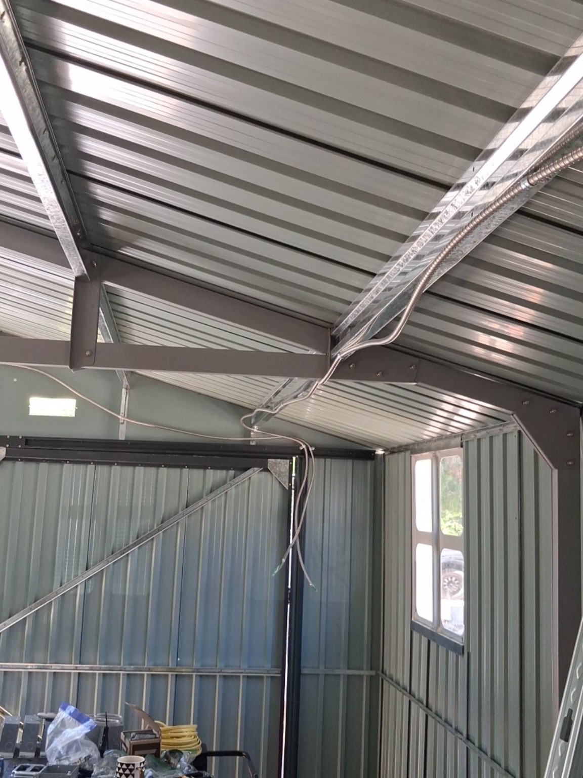 Electrical rough-in along the workshop roof framing