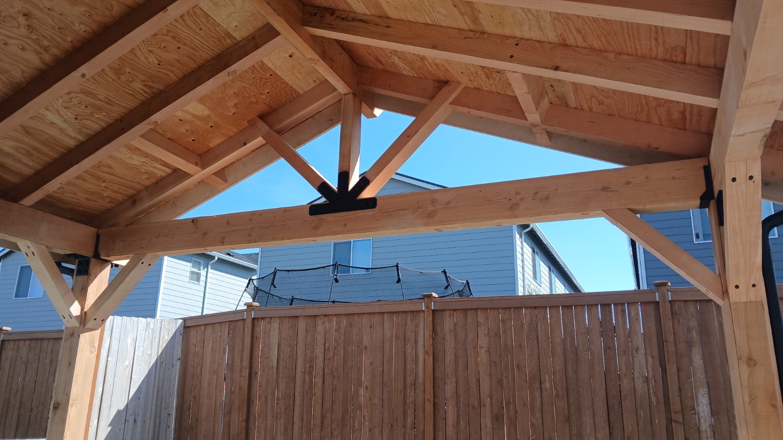 Exposed timber truss and decorative steel connector