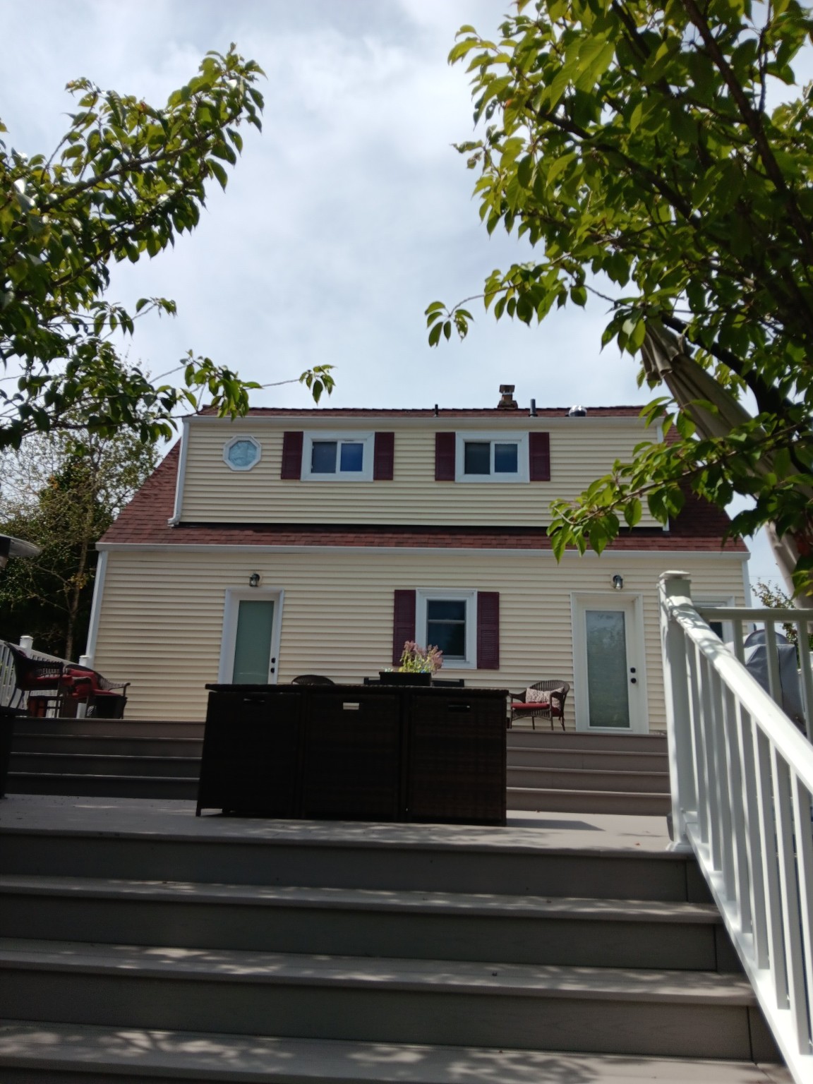 Wide view of the home with completed second-story window trim
