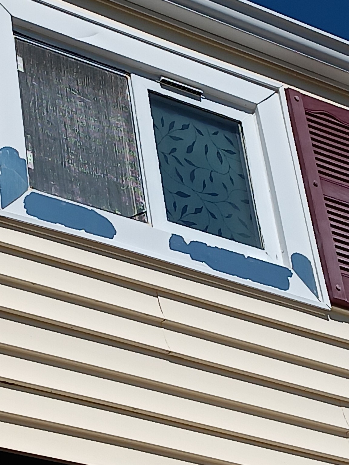 Close view of peeling exterior window trim coating