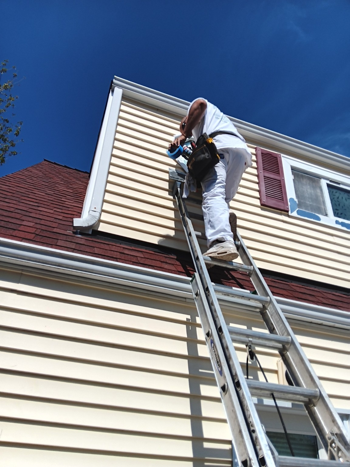 Detailed repair work on octagonal exterior window trim