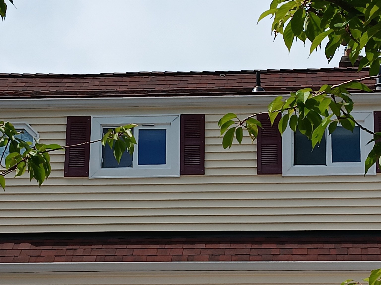 Restored white trim around a pair of exterior windows