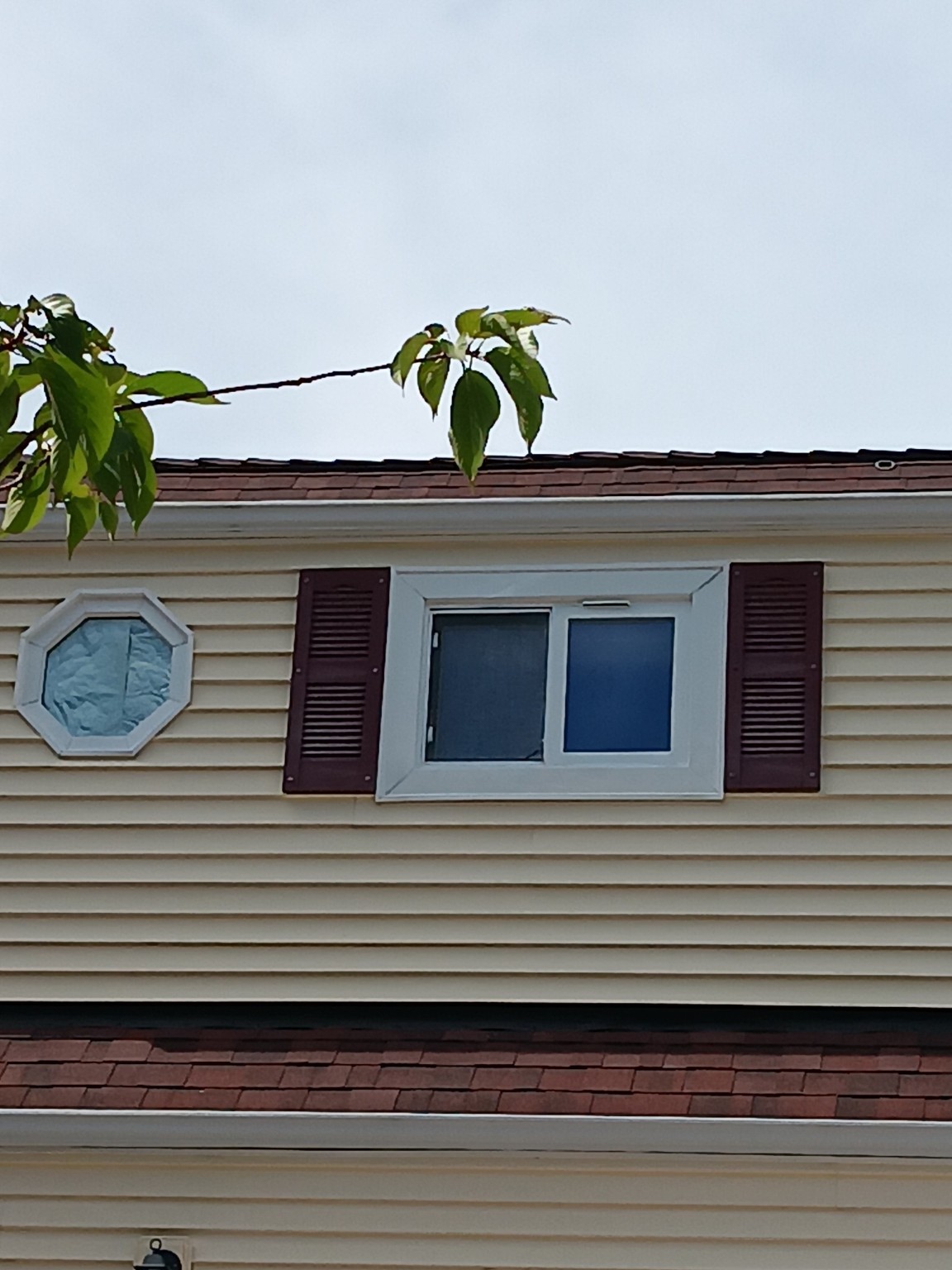 Completed white exterior window trim