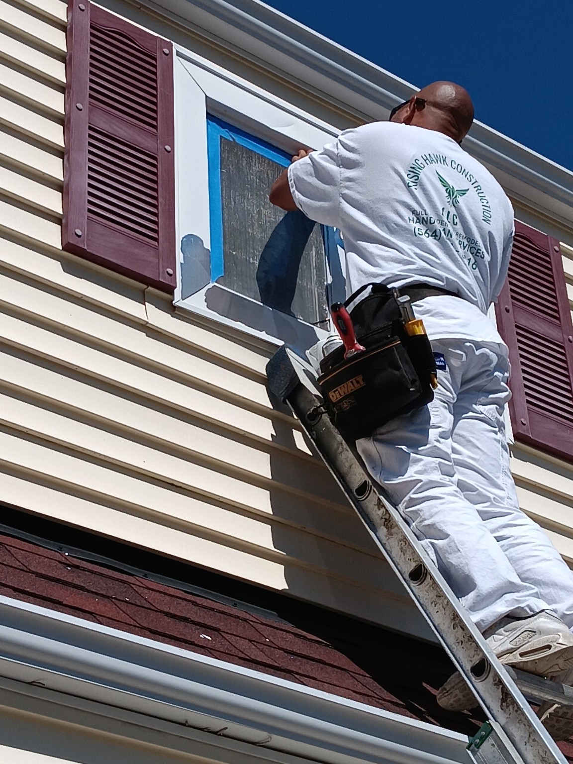 Window glass masked for exterior trim work
